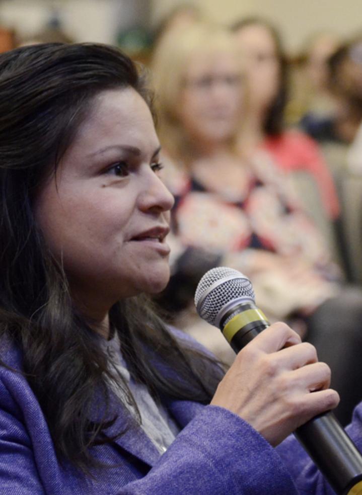 A shot of someone asking a question into a microphone