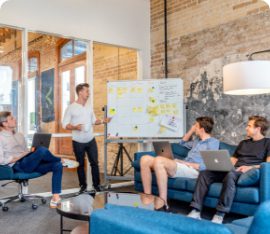 A brainstorming session among several people in a modern office