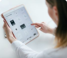 A woman using a tablet computer.